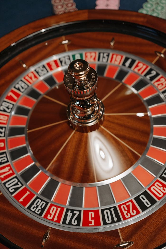 creative-02 Vibrant close-up of a roulette wheel spinning in a casino setting.